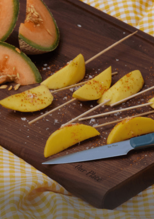 Precise Paring Knife cutting mango and cantaloupe on the Walnut Cutting Board