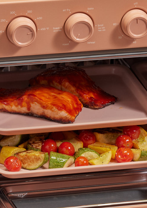 roasting salmon and vegetables In pink wonder oven