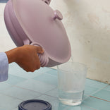 Straining out water from a purple Large Always Pan