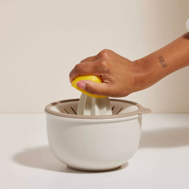 beige better bowl squeezing a lemon