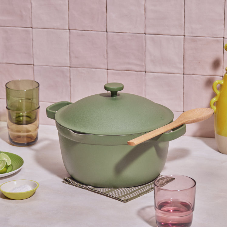 Green Perfect Pot resting on a table next to drinking glasses