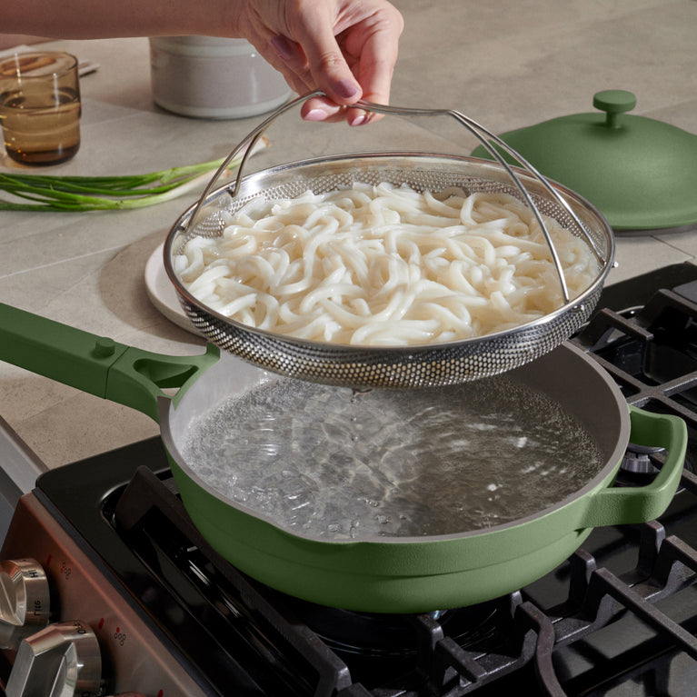 green always pan on stovetop with noodles