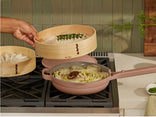 bamboo spruce steamer with pink always pan on stove