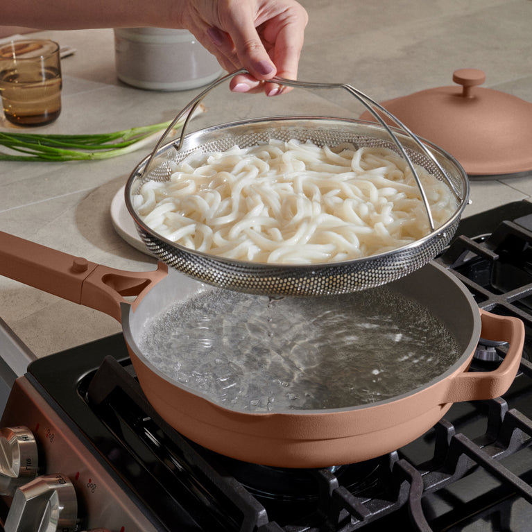 pink always pan on stovetop with noodles