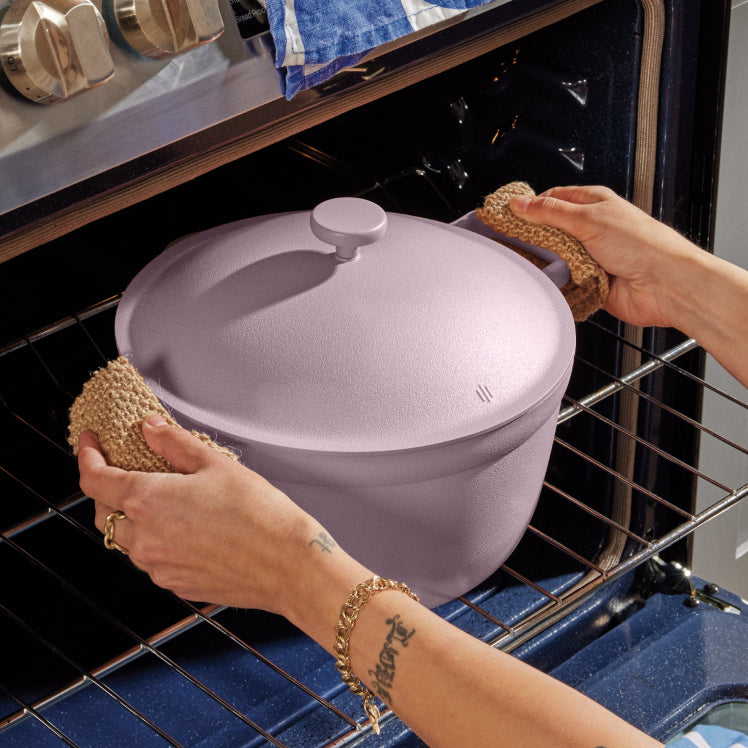 Removing a purple Perfect Pot from the oven